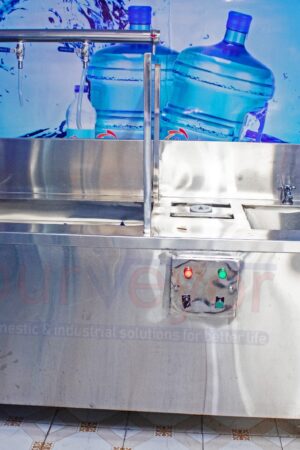 Three taps filling station with inbuilt complete bottle rinser